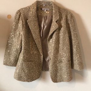 Jennifer Lopez tan sequence/ fluffy coat